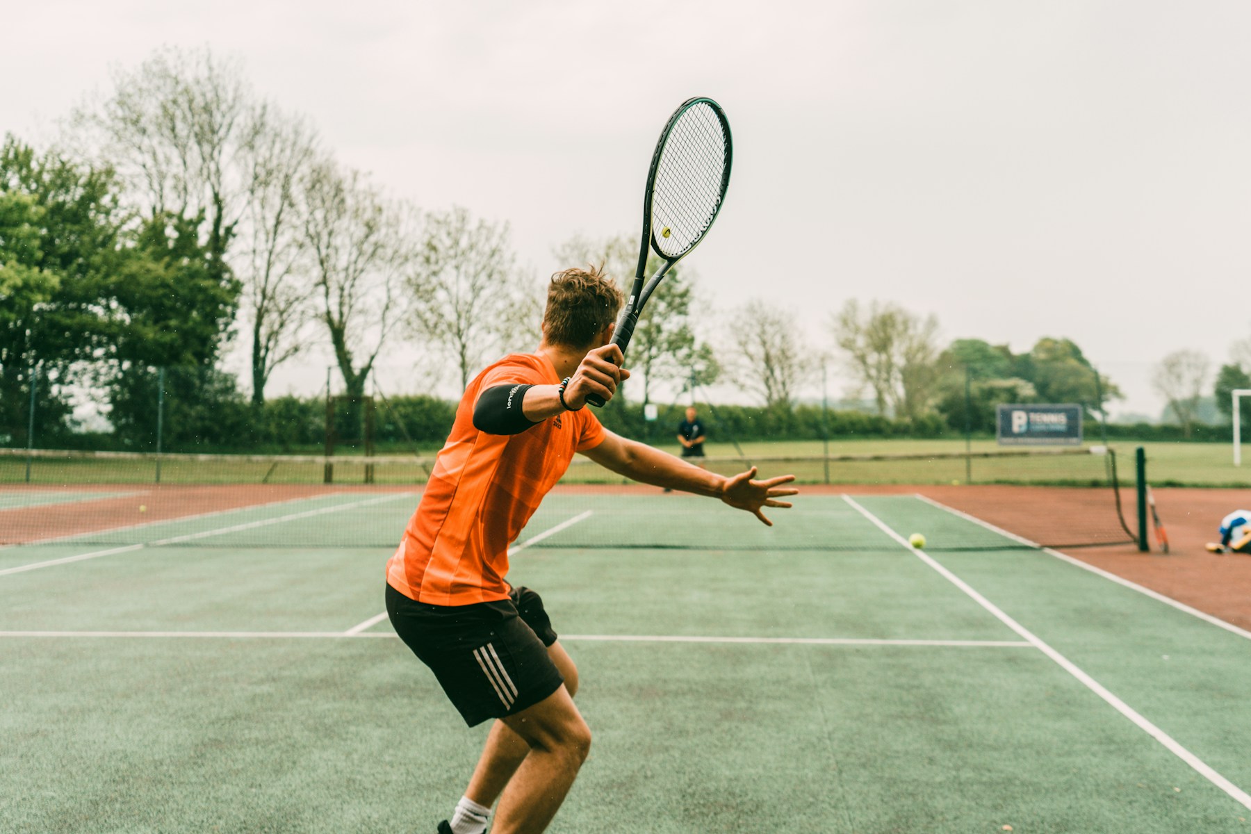 Tennis player wearing custom sweatbands for club and retail merchandise