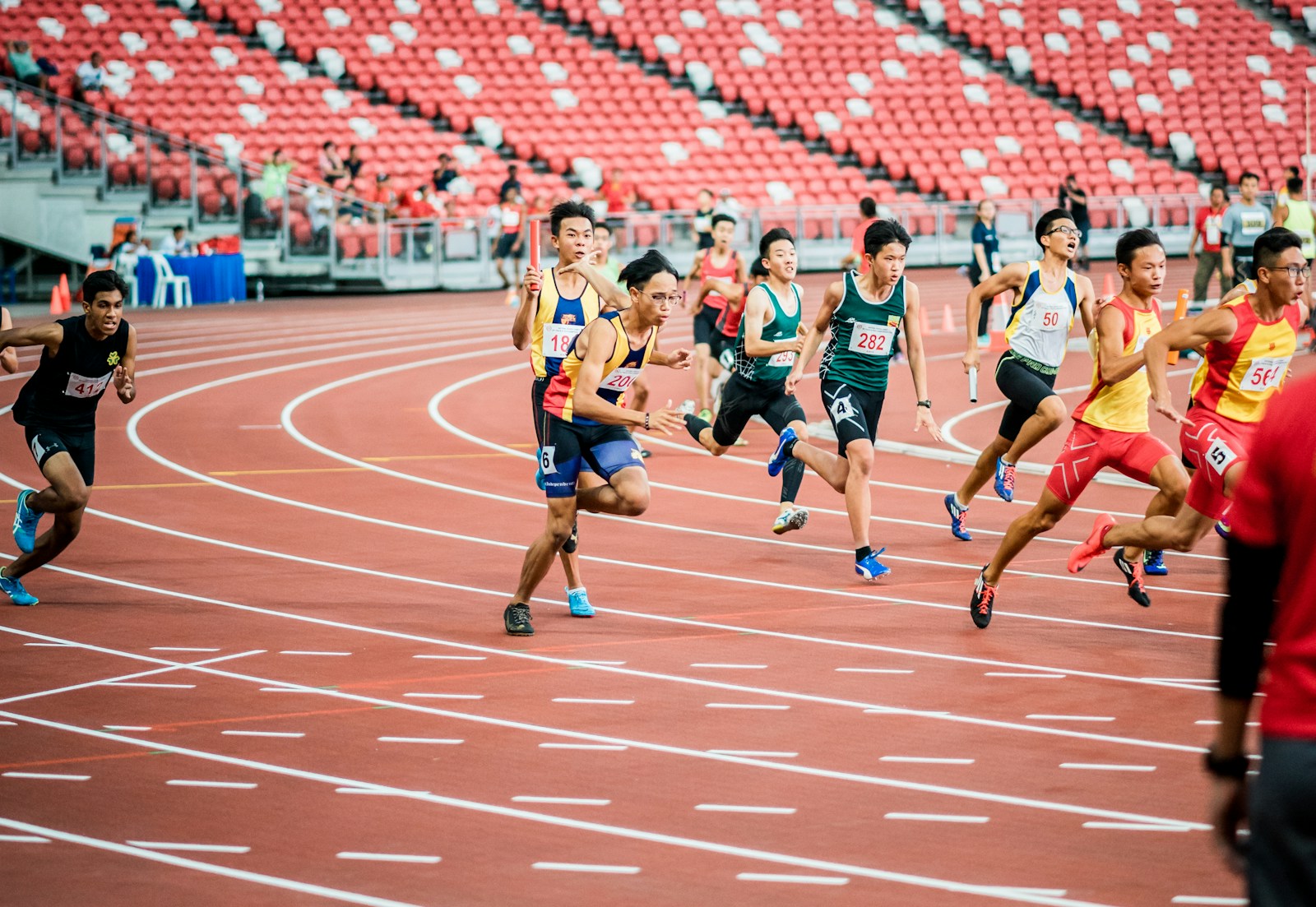 Athletes running on a field representing secure athletic comfort